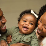 New-Parents-With-Their-Daughter-Photo-by-pixelheadphoto-digitalskillet-on-Shutterstock