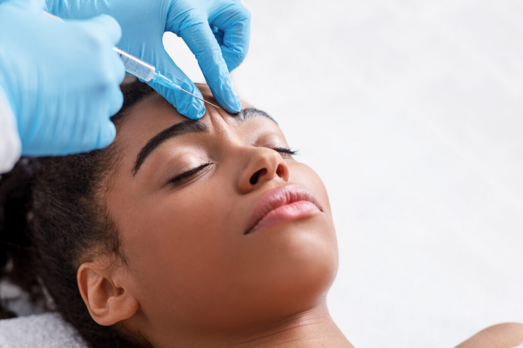 A-woman-getting-Botox-injections in her-forehead-Photo-by-Prostock-studio-on-Shutterstock