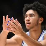Duke University basketball star Jared McCain during a game with blue nail polish. Photo by Grant Halverson/Getty Images