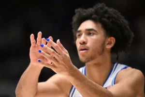 Duke University basketball star Jared McCain during a game with blue nail polish. Photo by Grant Halverson/Getty Images