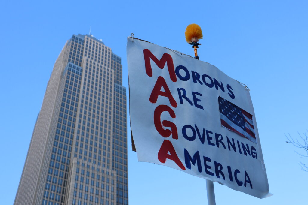 A MAGA sign shown at a protest as part of story on five times Trump has been the “least racist person” to Black Americans. (Credit: 2026 Anti ICE Protest / Nora Khatib)