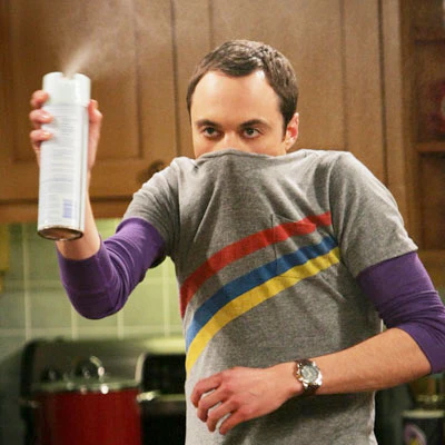 Sheldon from "The Big Bang Theory" spraying an aerosol can used as a featured image for a spring cleaning guide. (Credit: The Big Bang Theory | InClub Magazine does not claim ownership over this image.)