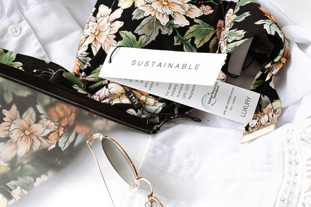 A sustainability clothing tag for a story on 10 stylish sustainable fashion brands. (Credit: Harper Sunday via Unsplash)