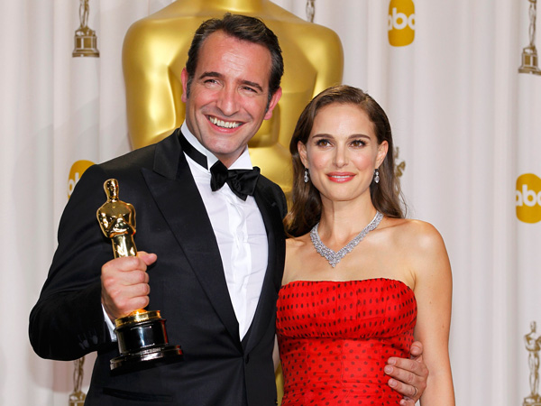 Jean Dujardin (left) and Natalie Portman (right) at the 2012 Oscars as part of a roundup of the last 20 year of Best Actor Oscar winners ranked. (Credit: AP Photo/Mark J. Terrill)