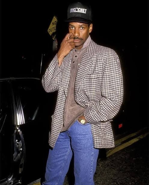 Denzel Washington in the '90s as part of a story on Black men influencing John F. Kennedy Jr.'s style. (Credit: Getty Images)