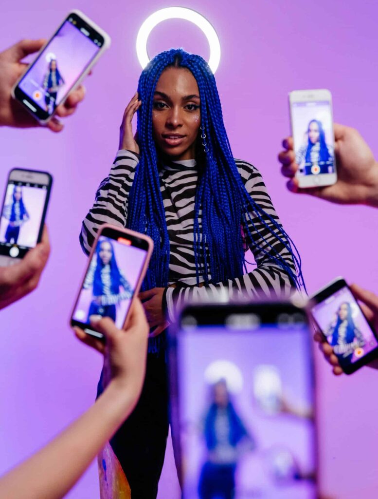 An influencer being photographed as part of a story on the era of the rebrand. (Credit: Pavel Danilyuk via Pexels)